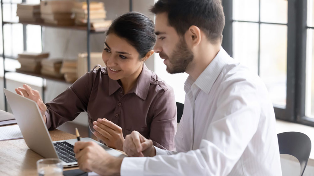 man woman in front of laptop